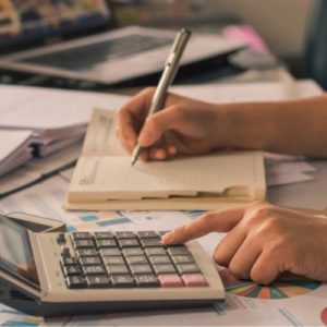 hand writing with calculator