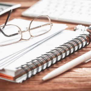glasses pen notebook