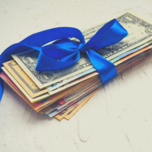 gift gifting money tied with blue ribbon