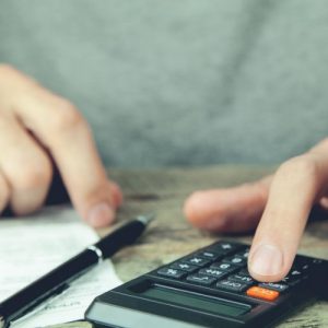 hand using calculator