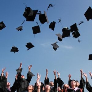college school throwing graduation caps